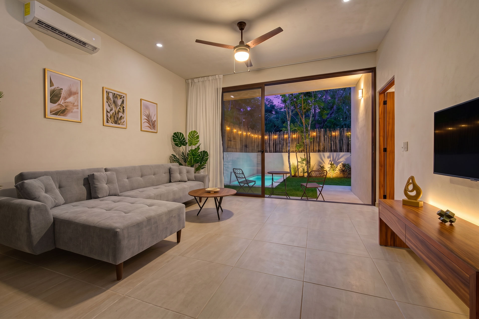 Bright living room opening to the private garden in a StellarResidences townhouse, Tulum