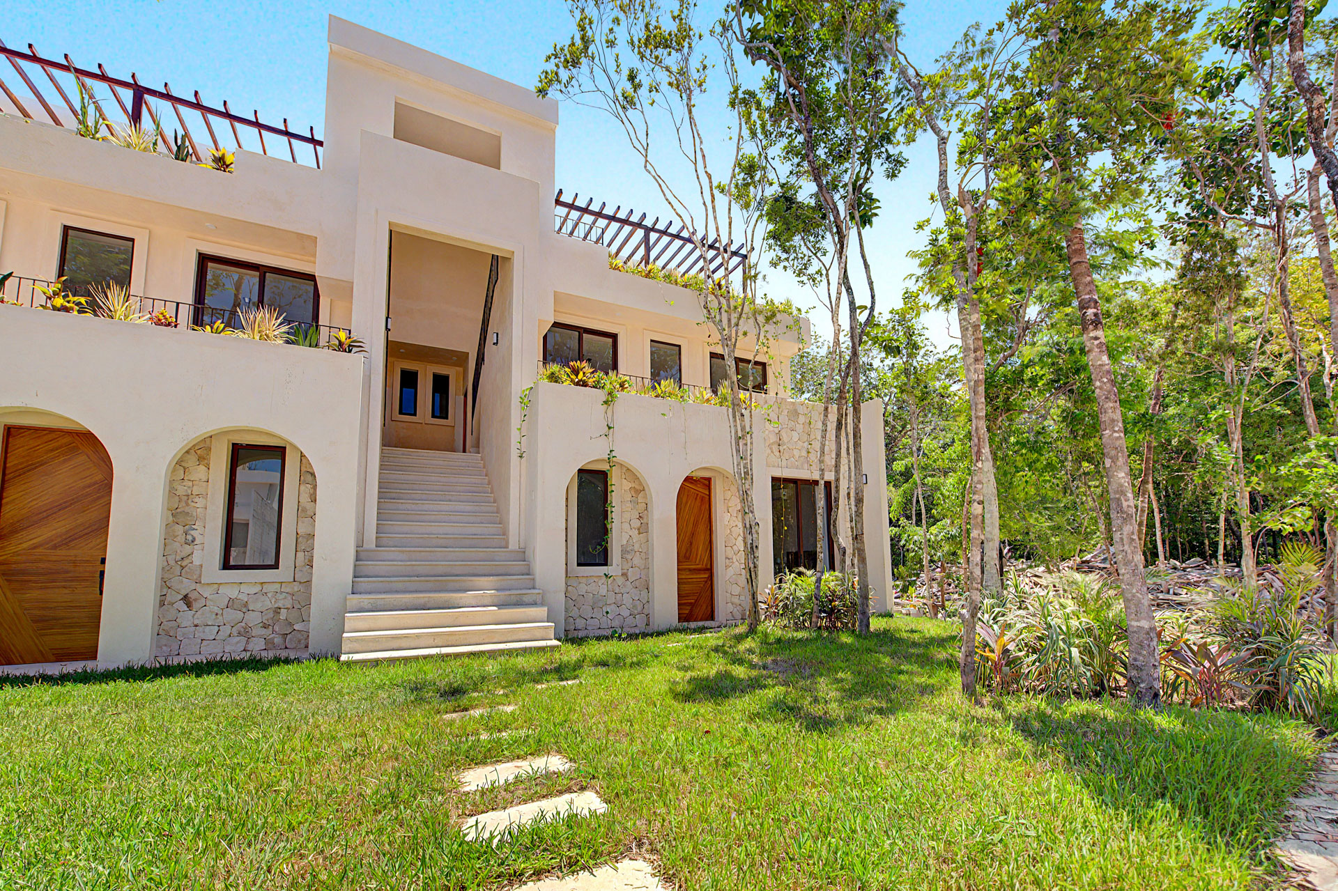 Front facade of StellarResidences townhouses and garden at Tulum Gardens, Tulum