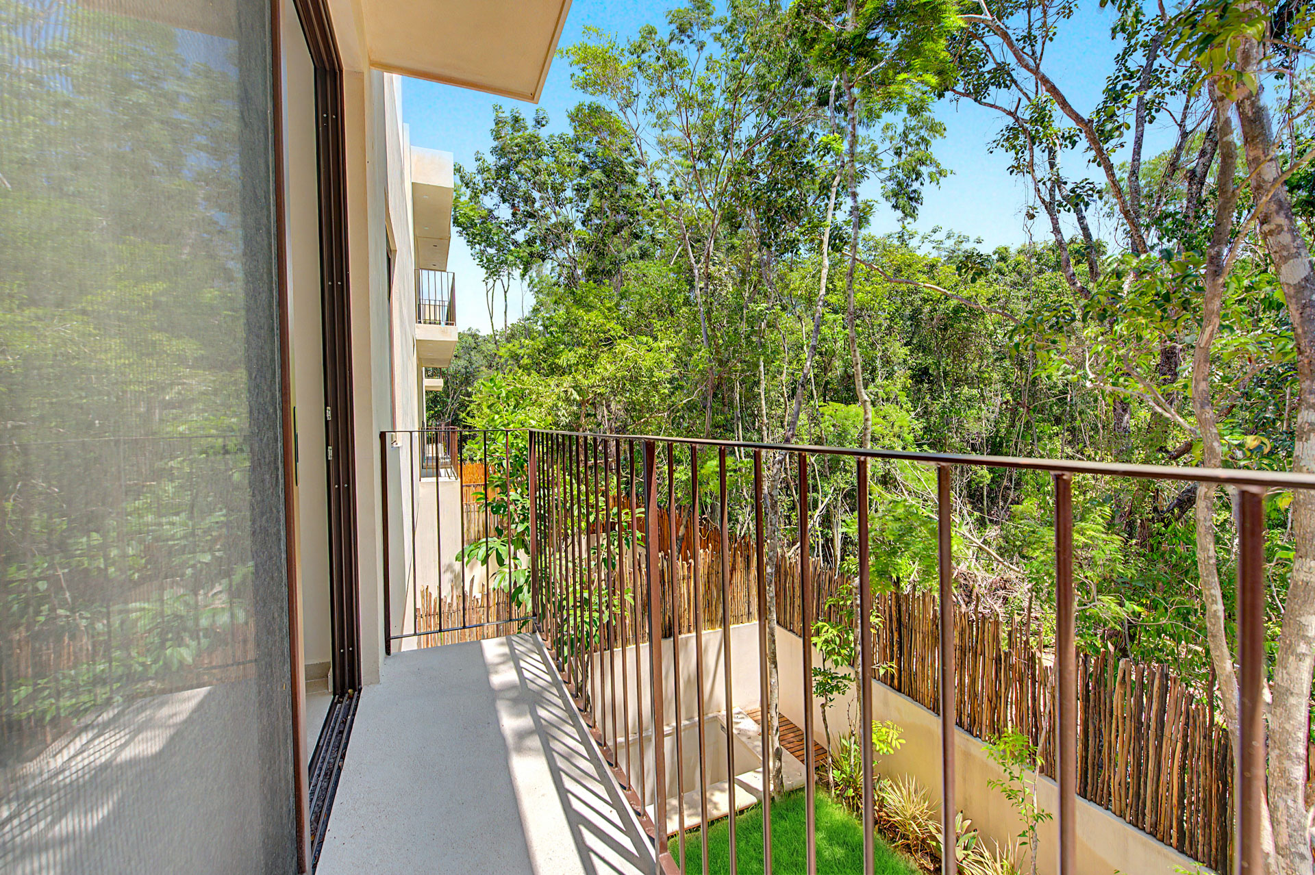 Balcony over the jungle at a Tulum Gardens townhouse